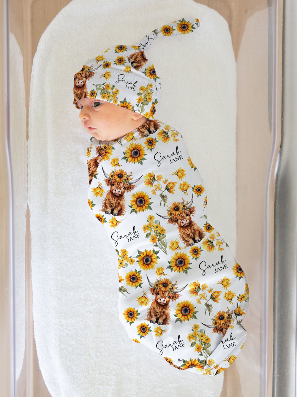Personalised baby swaddle and beanie set with custom name design by The Custom Co.
