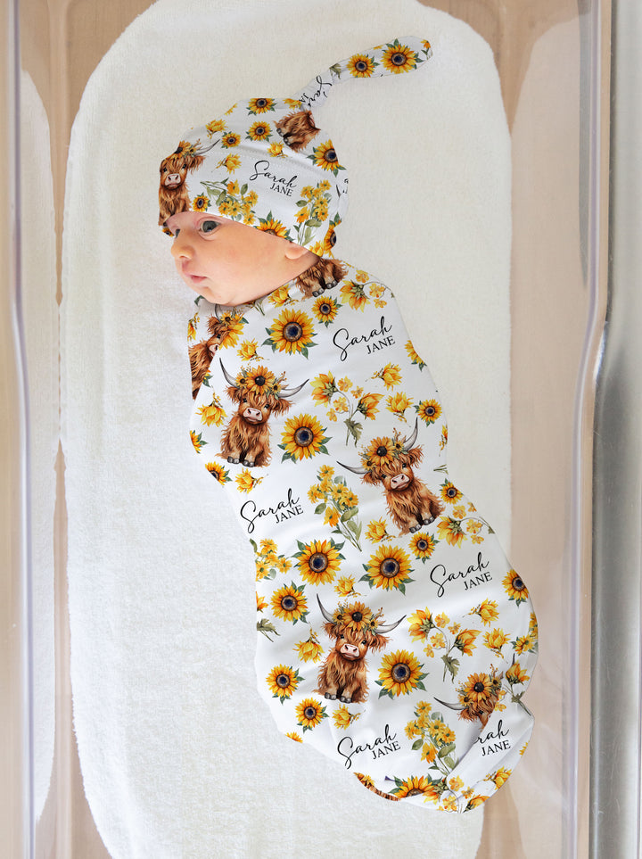 Personalised baby swaddle and beanie set with custom name design by The Custom Co.