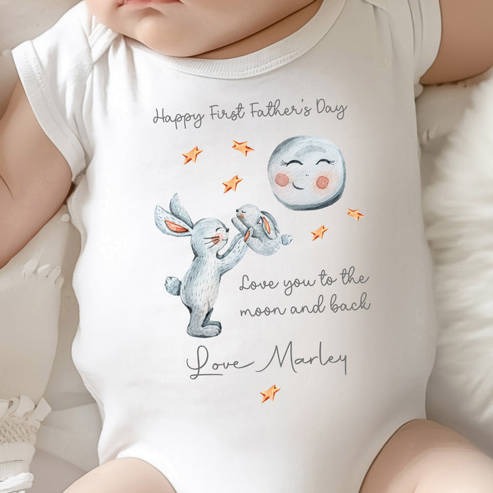 First Father’s Day baby onesie with “I Love You to the Moon and Back”