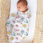 Custom muslin swaddle wrap personalised with baby’s name, soft breathable fabric, 120x120cm, gentle for newborns.