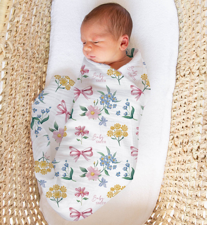 Custom muslin swaddle wrap personalised with baby’s name, soft breathable fabric, 120x120cm, gentle for newborns.