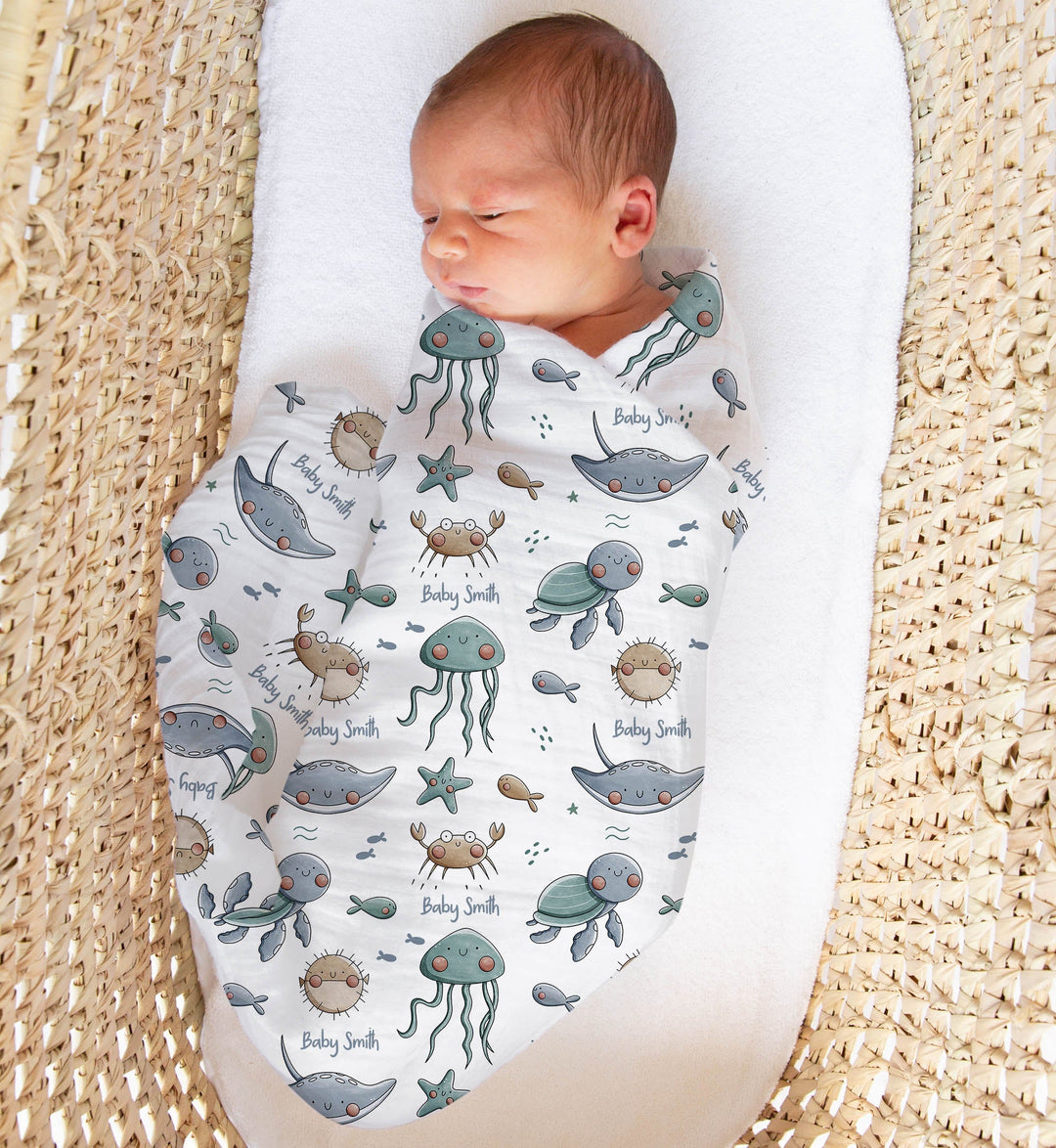 Personalised muslin swaddle wrap with baby name, soft breathable fabric, 120x120cm, ideal for newborns and gifts