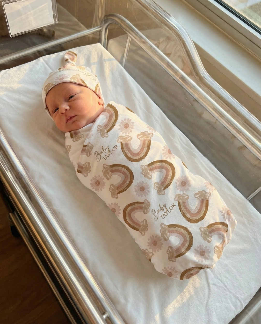 Custom baby swaddle wrap and beanie set made from soft stretch poly fabric with personalized design and name