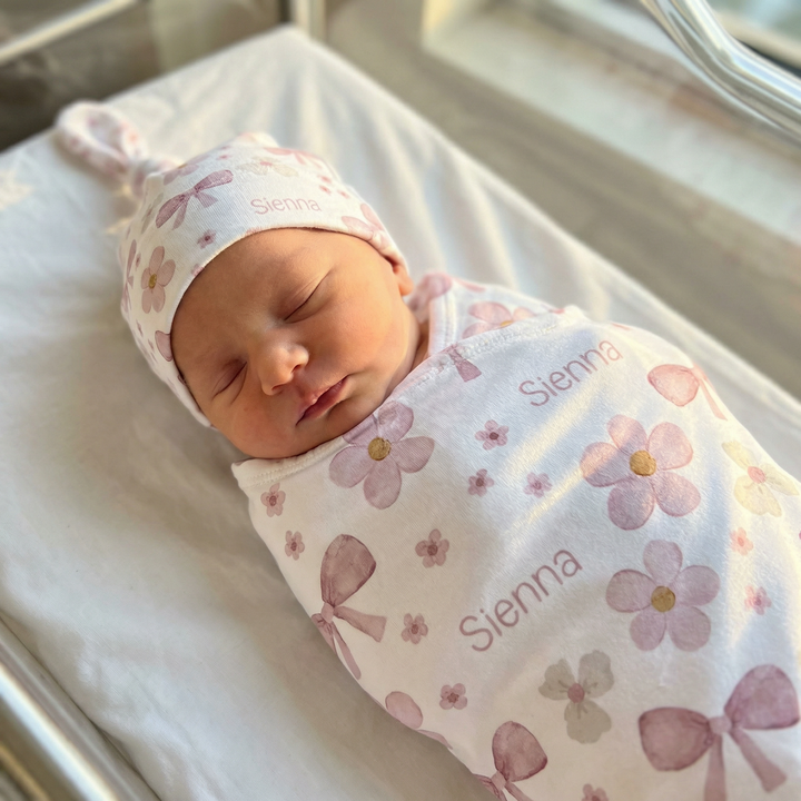 Personalised baby swaddle and beanie set made from soft stretch poly fabric for newborn comfort and style