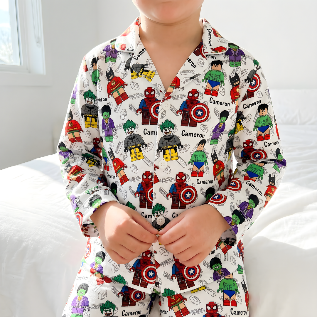 Long sleeve personalised kids pyjamas with all-over print and child's name, soft breathable fabric, and matching pants.