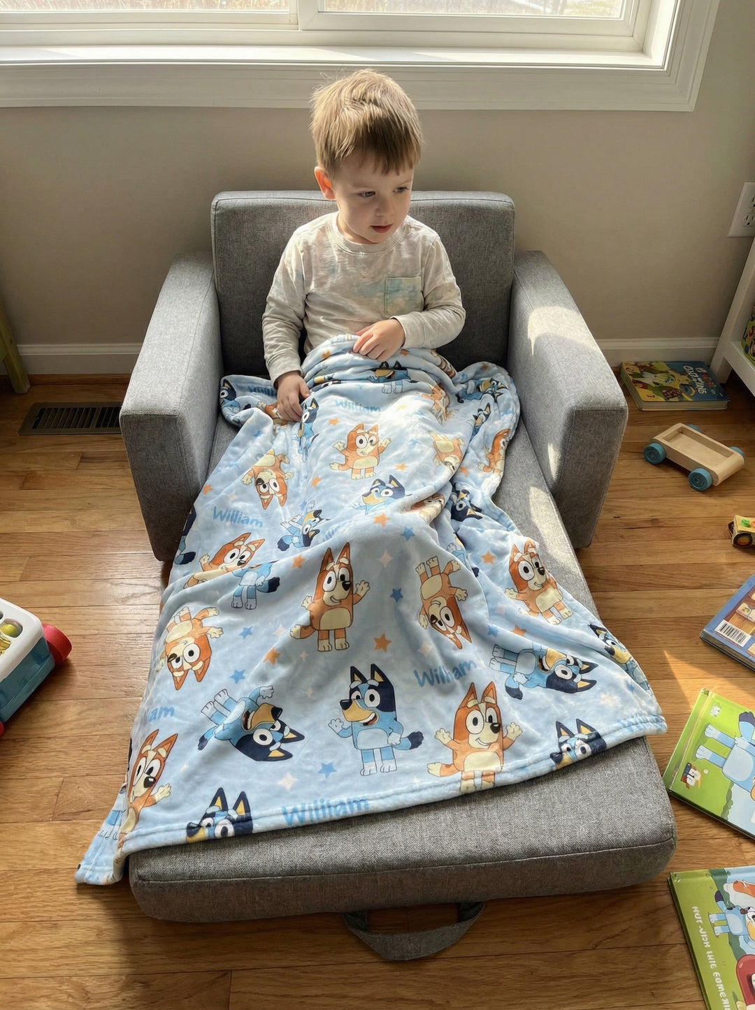 Soft personalised baby blanket with edge-to-edge printed design and plain white reverse side.