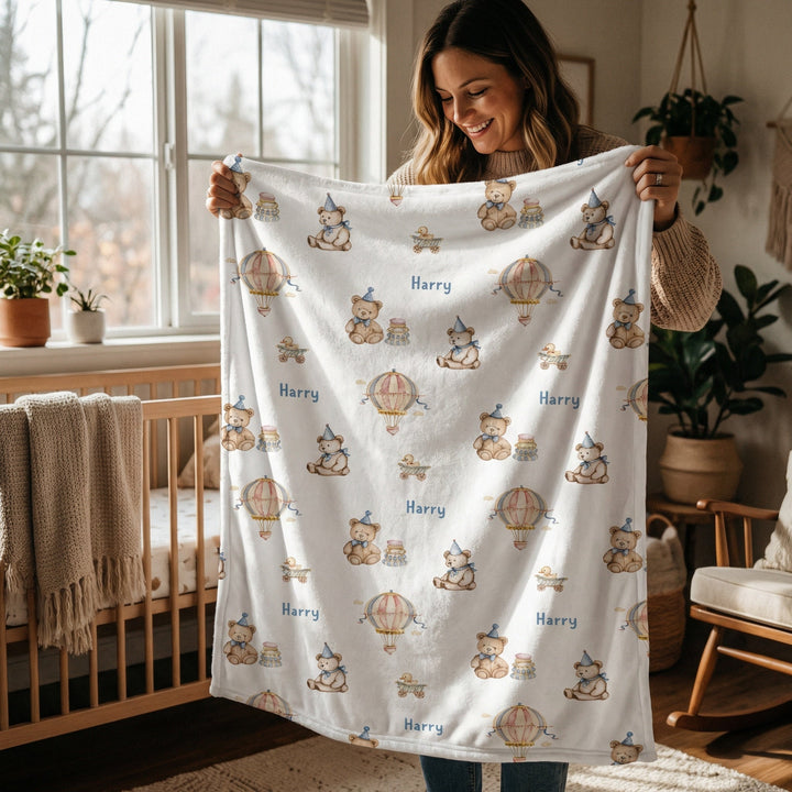 Soft personalised baby blanket with custom edge-to-edge print and plain white reverse side.