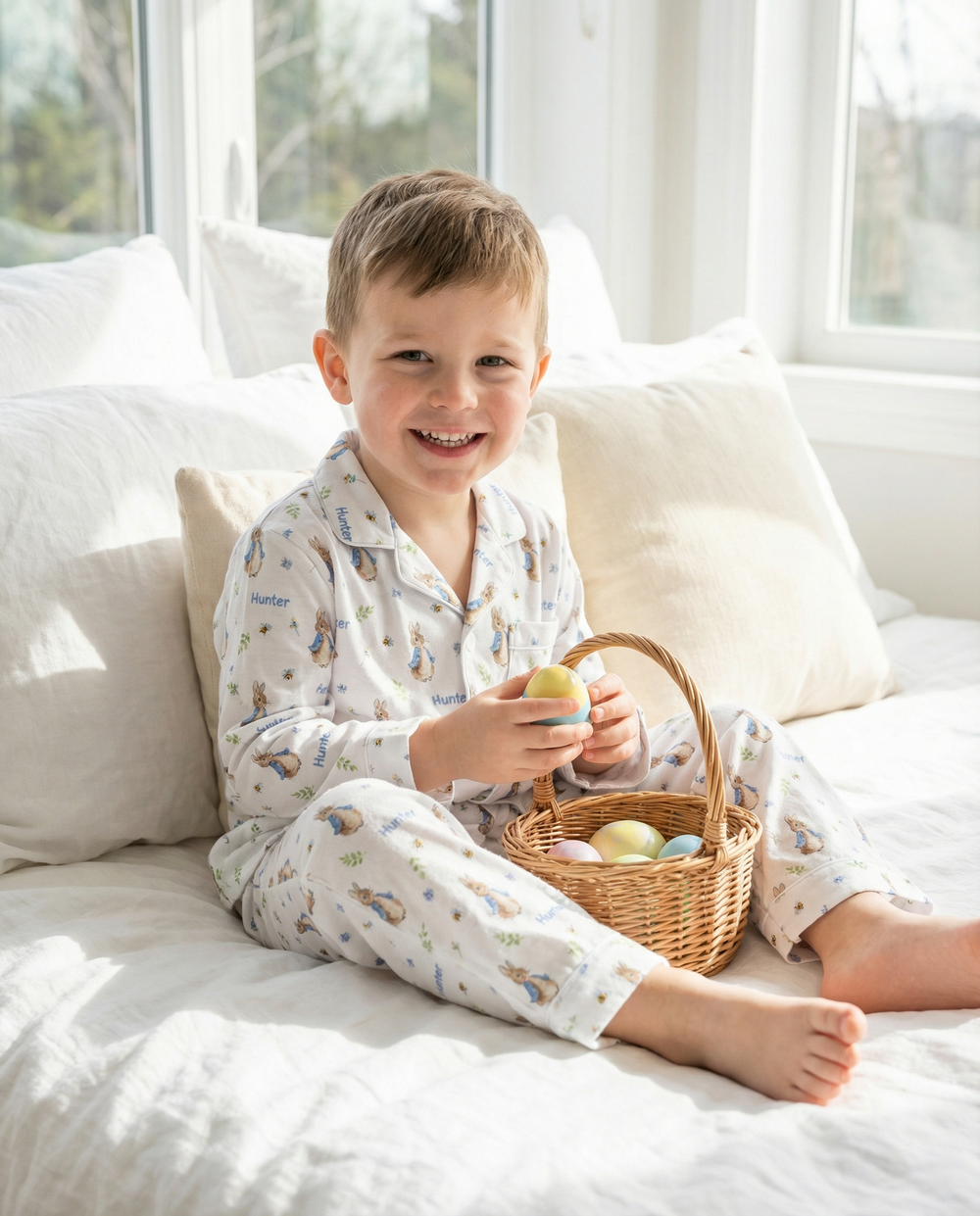 Personalised long sleeve kids Easter pyjamas with all-over Easter prints and child’s name on breathable, soft fabric.