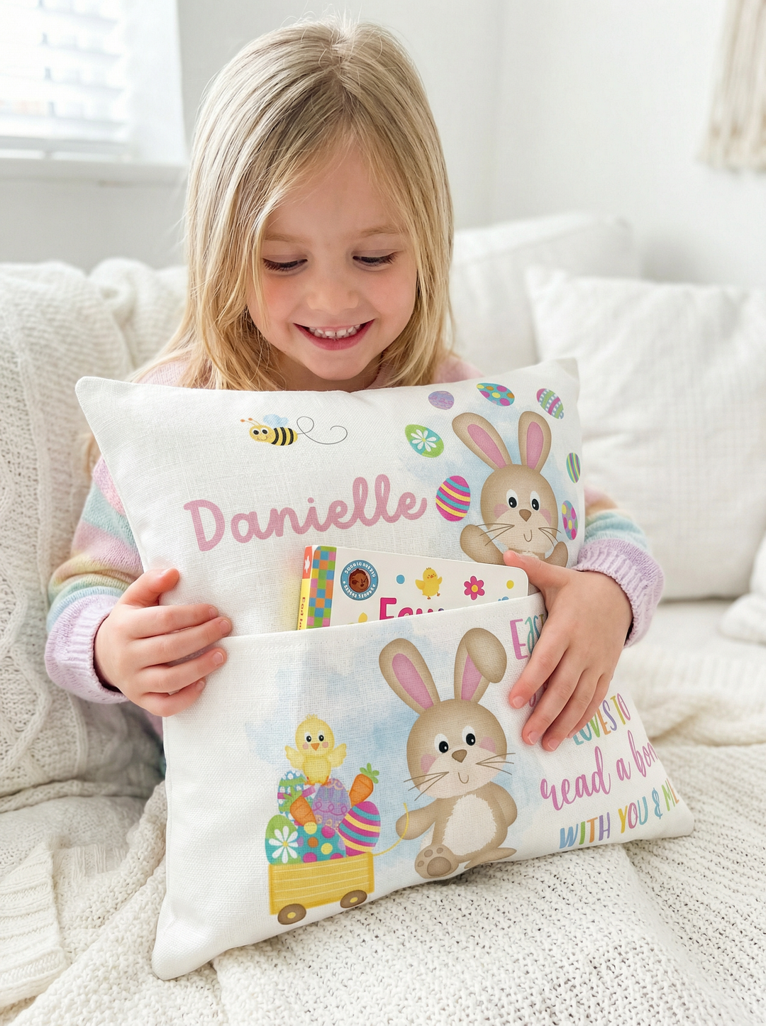 Personalised pink Easter pocket book cushion with bunny design and name slot for kids' bedroom decor