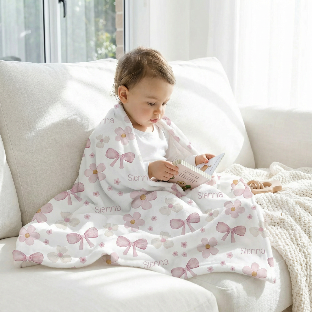 Soft personalised baby blanket with customised edge-to-edge print and plain white reverse side