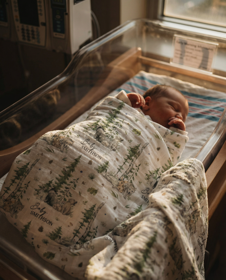 Custom muslin swaddle wrap personalized with baby’s name, soft breathable fabric, 120x120cm size for newborns.