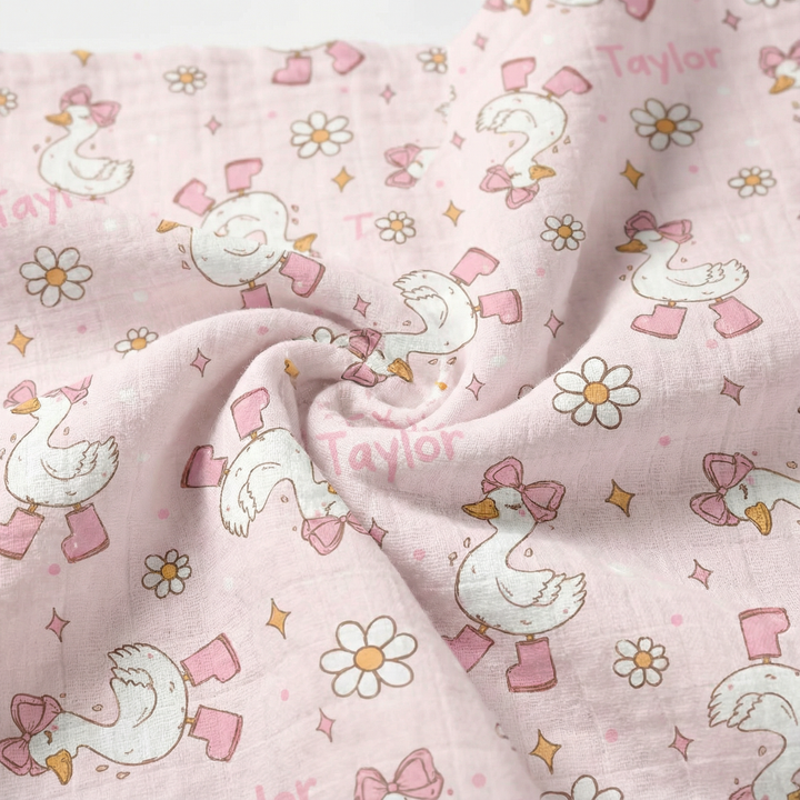 Personalised muslin swaddle wrap with baby name, soft breathable fabric, 120x120cm size, gentle for newborns