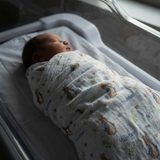 Personalised muslin swaddle wrap with baby name, soft breathable fabric, 120x120cm, ideal for newborns and gifts