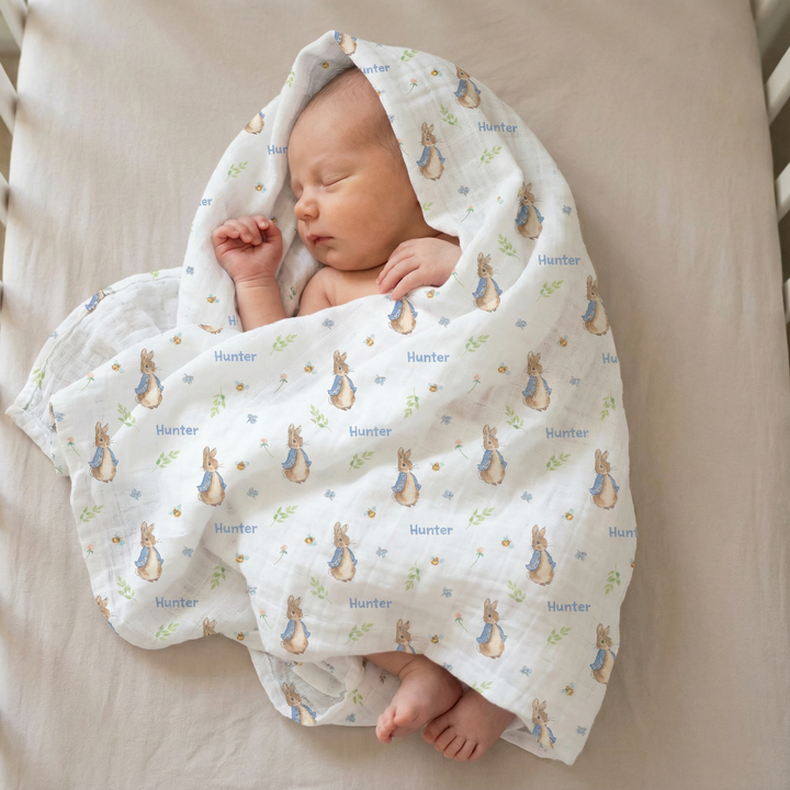 Personalised muslin swaddle wrap with baby name, soft breathable fabric, 120x120cm, gentle for newborns and babies.