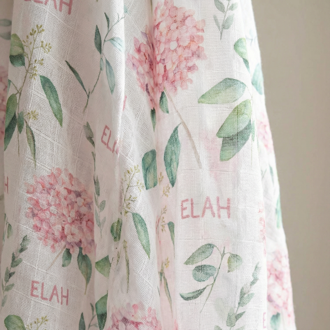 Personalised muslin swaddle wrap with baby’s name, soft breathable fabric, 120x120cm size for newborn comfort and versatile use