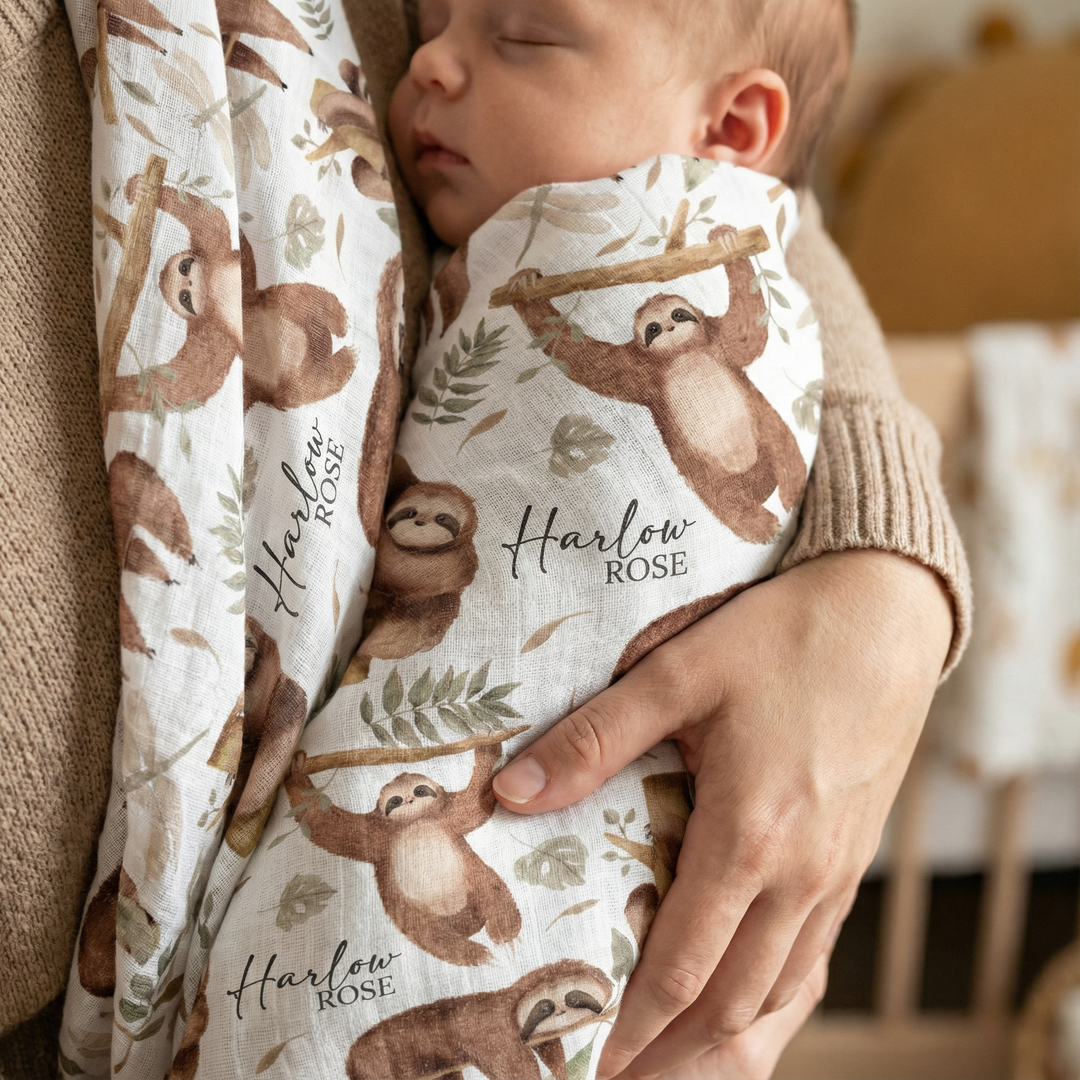 Custom muslin swaddle wrap personalized with baby’s name, soft breathable fabric, 120x120cm size for newborns.