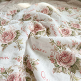Personalised muslin swaddle wrap with custom baby name, soft breathable fabric, 120x120cm size, ideal for newborn comfort and gift.
