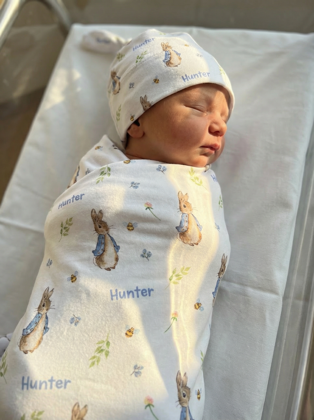 Personalised swaddle and beanie set made from soft stretch poly fabric for newborn comfort and style