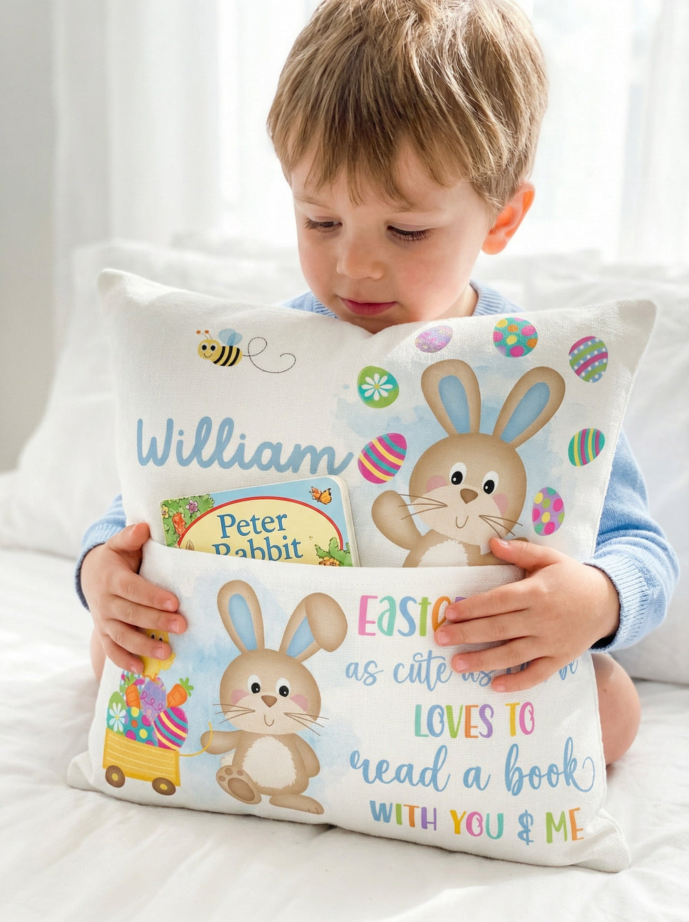 Blue personalised Easter pocket book cushion with bunny design and name pocket for kids' books