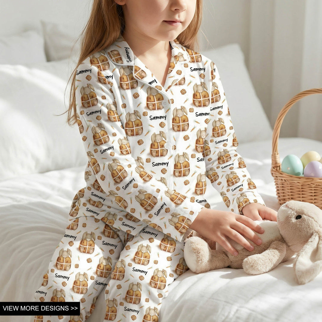 Personalised kids' long sleeve Easter pyjamas with all-over festive print and child’s name.