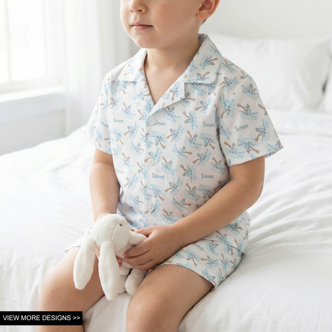 Child wearing personalised Easter pyjamas with short sleeves and shorts featuring festive Easter prints and name customization